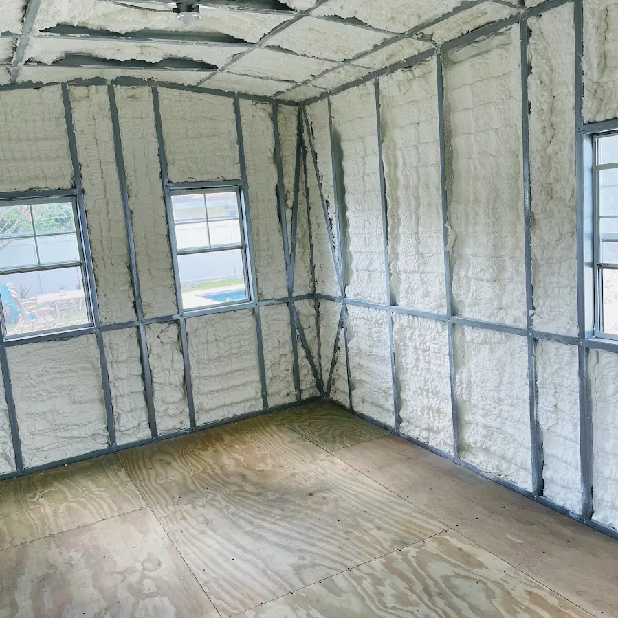 Closed-cell spray foam insulation applied to wall cavities in a residential project in Rainsville